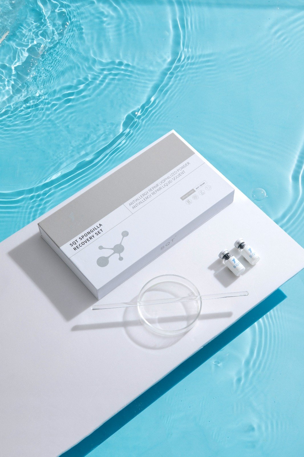 SQT Spongilla Recovery Set beside two treatment vials